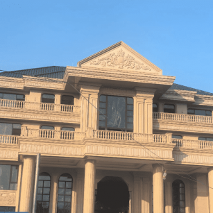 攀枝花黄金麻别墅外墙干挂石材效果示例